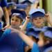 A Safety Town graduate holds her cap on after graduation at Dicken Elementary School on Friday, July, 26, 2013. Melanie Maxwell | AnnArbor.com